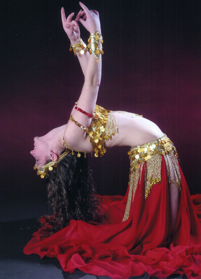 Donna performs a backbend while belly dancing