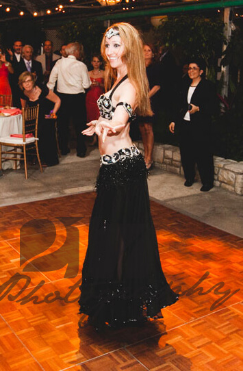 Donna performs a belly dancing routine for an event