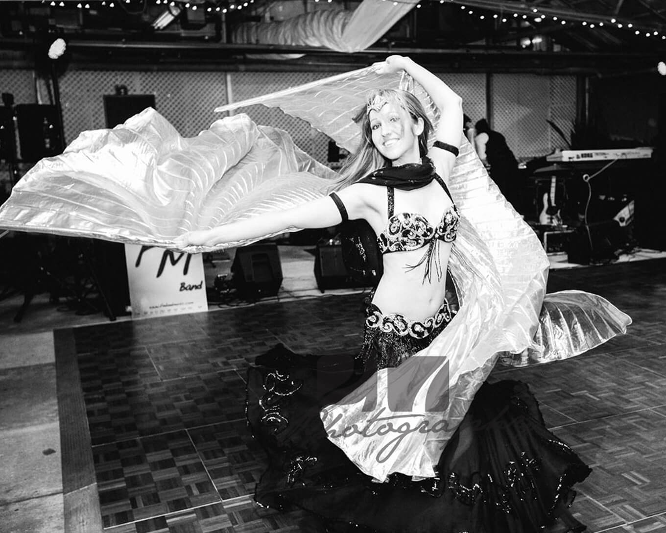 Donna wearing her isis wings belly dance outfit. Performing at a wedding event.
