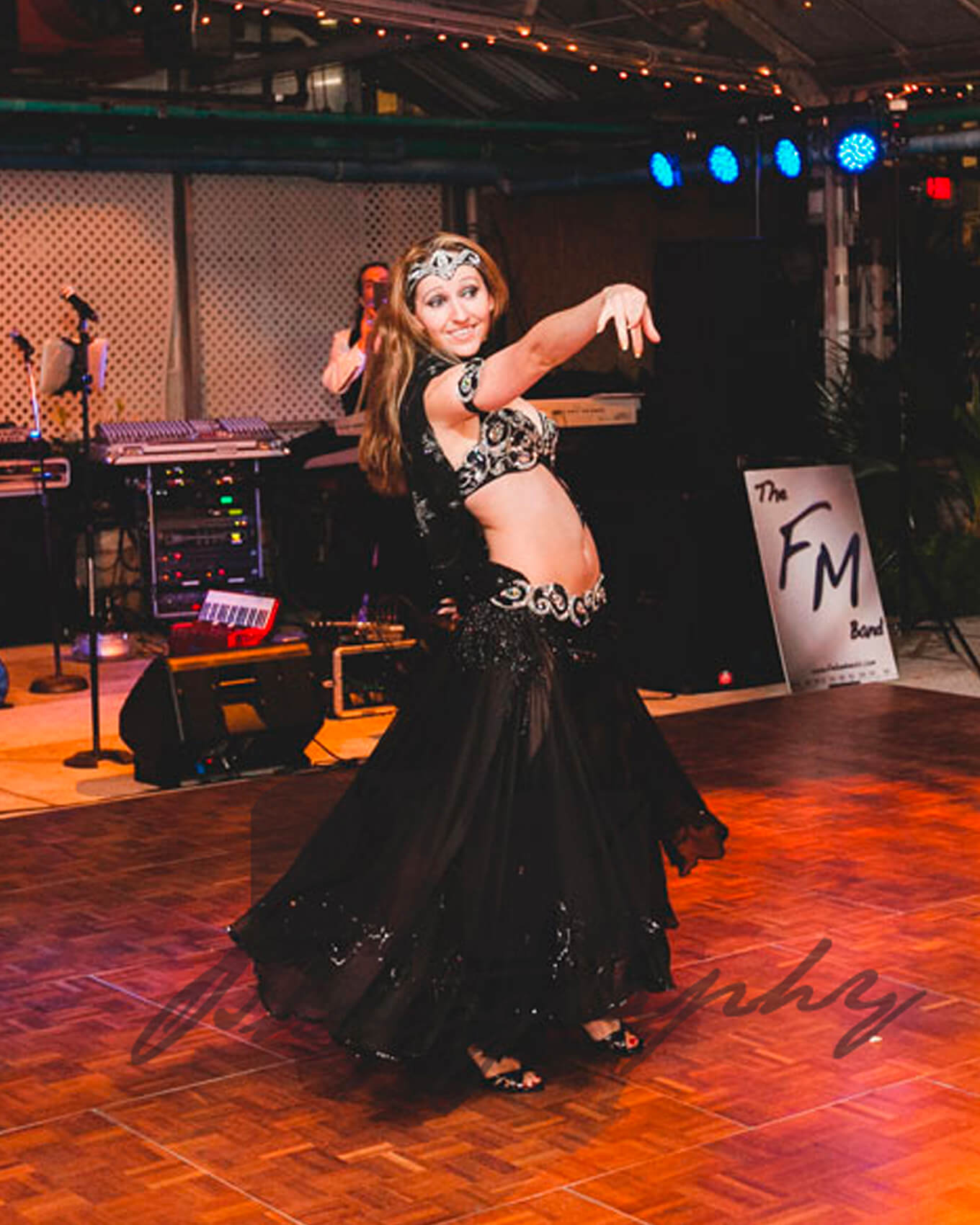 Donna performs a live belly dancing show at an event