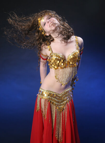 Donna in a red and gold belly dance outfit