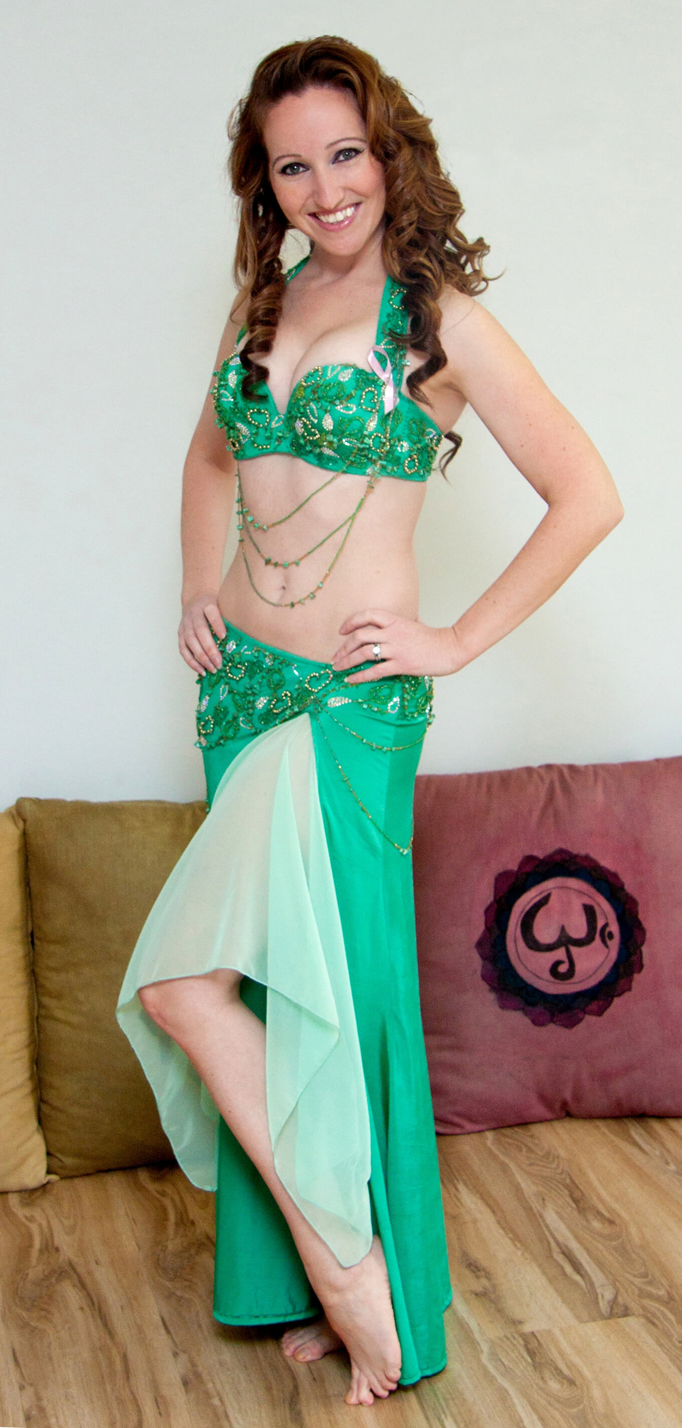 Donna in a green belly dance outfit